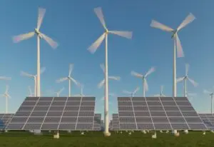 No gramado, fileiras de painéis solares captam a luz do sol, enquanto turbinas eólicas giram ao fundo sob um céu azul, mostrando como os sistemas híbridos funcionam na geração inovadora de energia renovável.