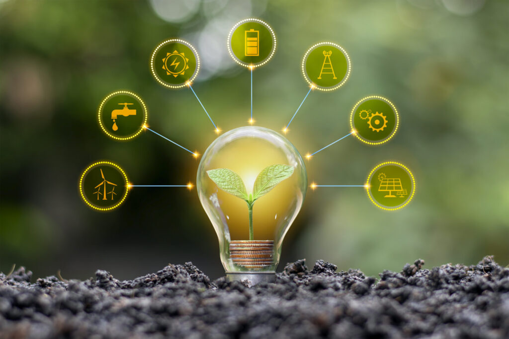 Lâmpada com planta cresce sobre solo, cercada de ícones amarelos com tipo de energia.